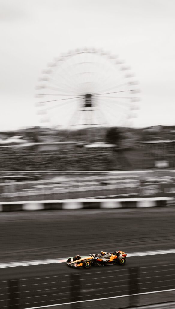 photography of lando norris in the suzuka japan F1 GP of April 2025, next to the famous ferris wheel